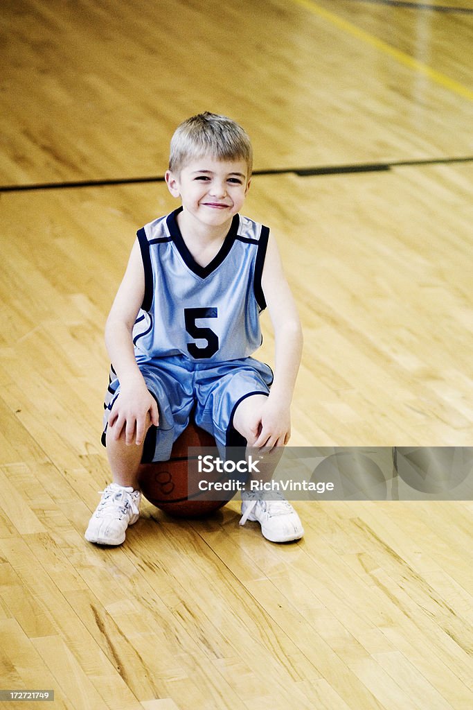 Little B Baller A young boy takes a break from hoops. 4-5 Years Stock Photo