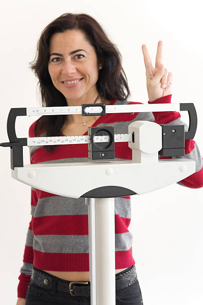 istock happy at the weight scale 172721948