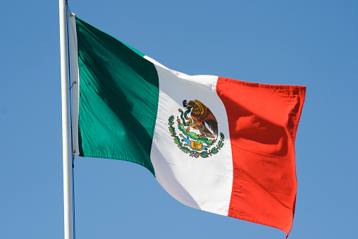 National flag of Mexico waving 3D Render flagpole and blue sky, United Mexican States flag textile by Agustin Iturbide, Francisco Eppens Helguera, coat of arms Mexico independence day. illustration