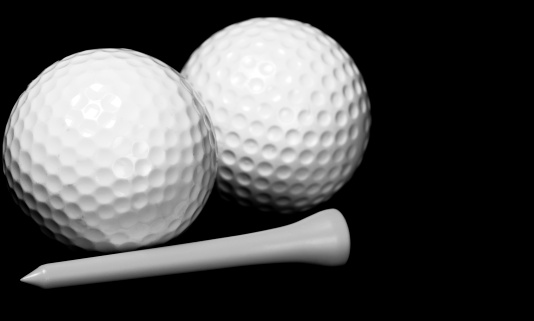 Golf Balls & Tee - Shallow Dof - Focus is on left ball and the tip of the tee.