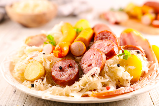 sauerkraut, cabbage and sausage on plate