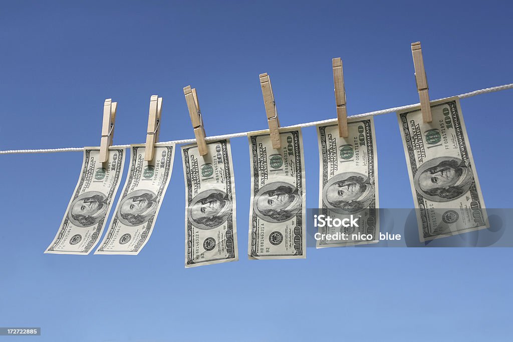 Hanging $100 bills Hanging $100 bills on a clothesline. Money Laundering Stock Photo