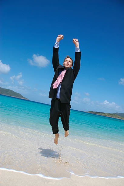 istock Businessman Takes off from Tropical Beach 172722924