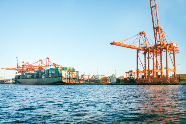istock Comemercial Ship Docked at Marine Terminal Loaded with Multi-Colored Containers 1727230865