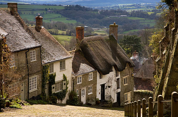 Gold Hill "Gold Hill in Shaftesbury, Dorset, England." shaftesbury england stock pictures, royalty-free photos & images