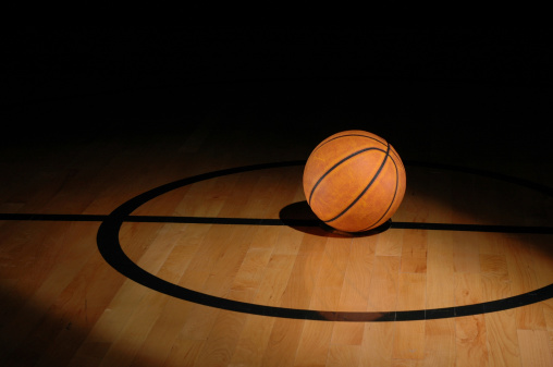 A basketball sits on a gymnasium floor.My basketball lightbox:
