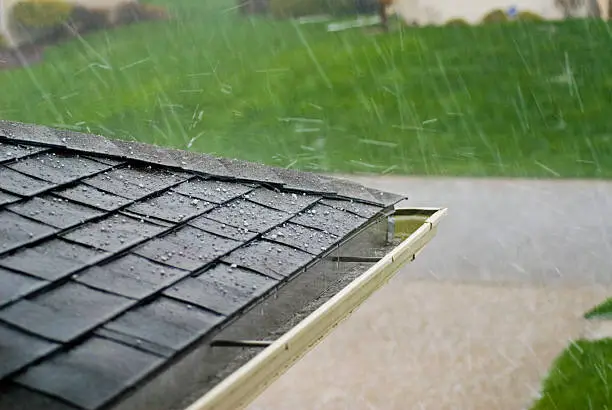 Photo of Hail Stones Hitting Roof During a Storm, horizontal