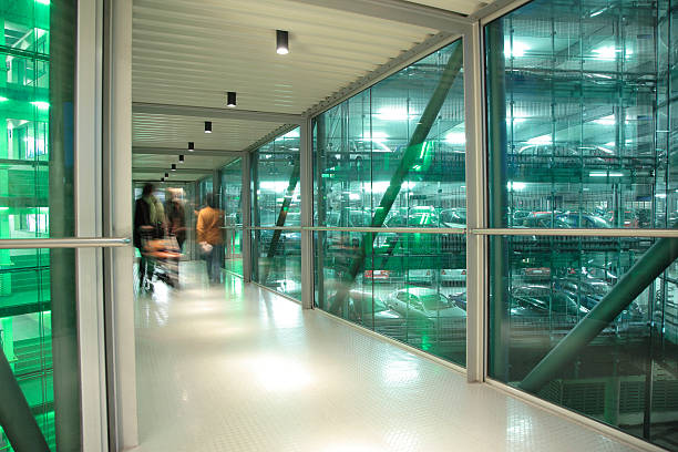 istock Blurred Customers Walking in Elevated Pedestrians Walkway to Parking Garage 172723725