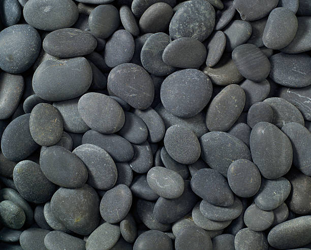 istock Close-up view of Black river rock stones for textured background 172723745