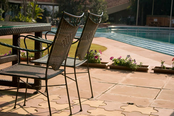 Plastic outdoor table and chair by building exterior wall in Anna Maria Island, Florida