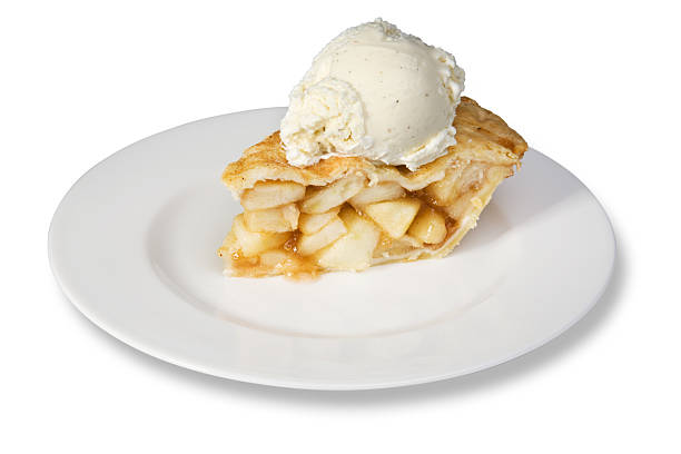 Slice of apple pie with ice cream A slice of apple pie with a scoop of vanilla ice cream. Isolated on white with clipping path. apple pie and ice cream stock pictures, royalty-free photos & images