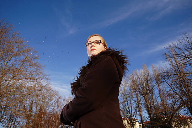 looking girl and blue sky stock photo