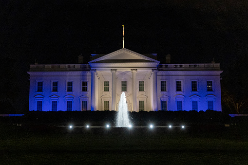 The White House, Washington, DC at night taken with a large telephoto lens.