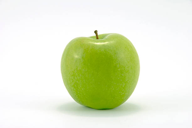 Close-up of fresh Granny Smith apple Granny Smith Apple on white background isolated apple stock pictures, royalty-free photos & images