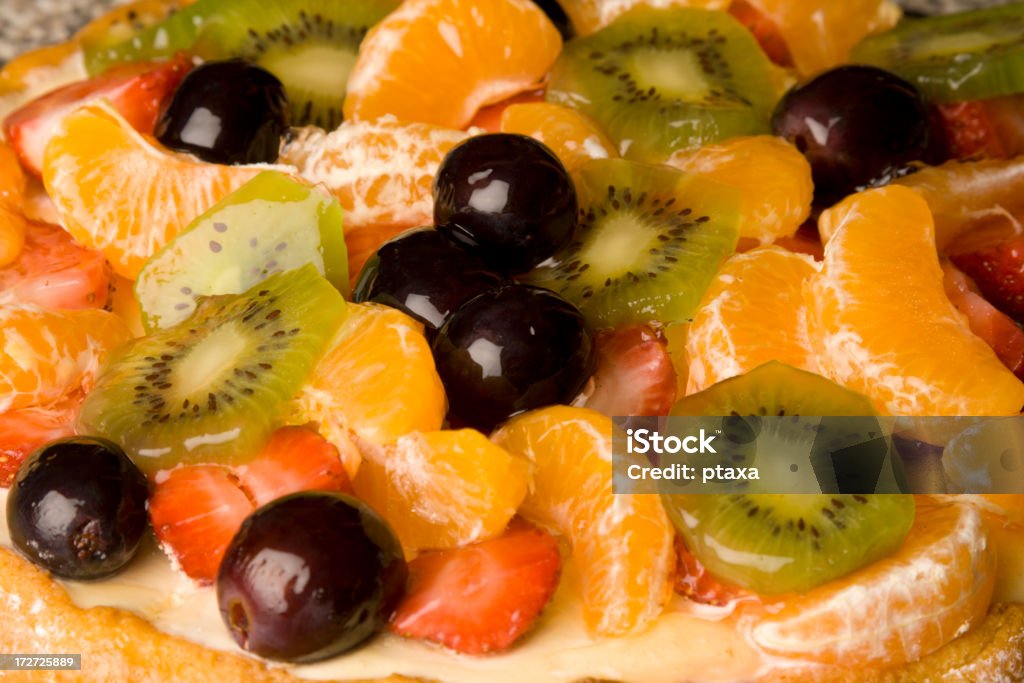 Torta di frutta topping'multicolore - Foto stock royalty-free di Dessert di gelatina