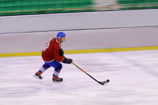Ice hockey player in the action (blurred motion)