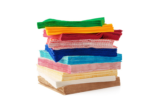 Colorful stack of paper napkins on white background studio shot