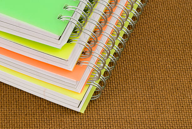 Notebooks on brown background stock photo