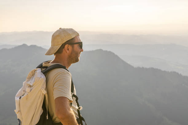 istock Hiker relaxes on sunny mountain ridge 1727278230