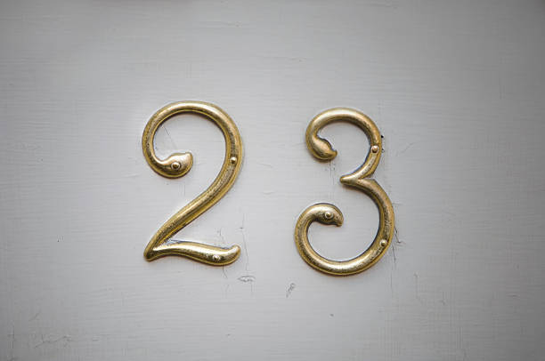 Doorplate with twentythree on it Picture of the golden house number twentythree psalms stock pictures, royalty-free photos & images