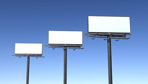 Three billboards isolated against blue sky stock photo