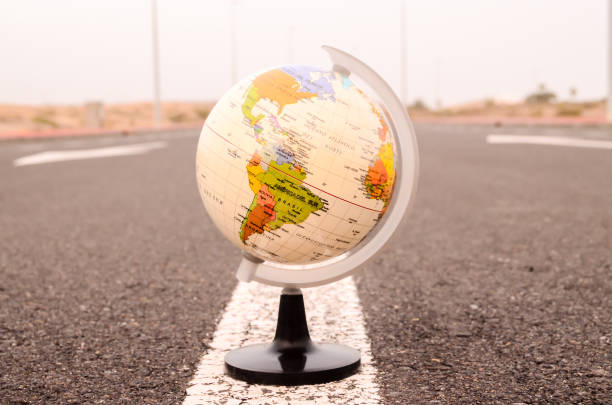 istock Globe Earth on an Asphalt Street 1727286131