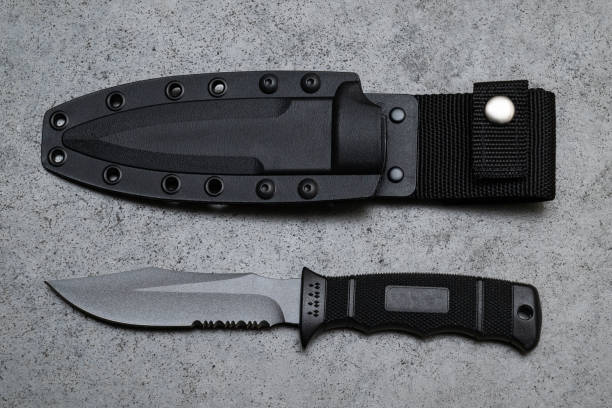 istock Modern penknife and black case on a gray table 1727291533