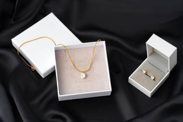 istock Golden necklace on silk texrtile background close up 1727292621