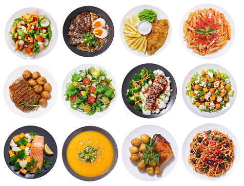 set of plates of food isolated on a white background, top view