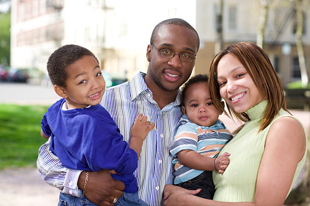 istock Smiling man, woman, and two small boys outside 172730654