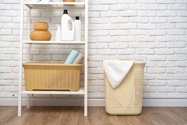 istock Beige plastic basket for laundry in a room 1727306956