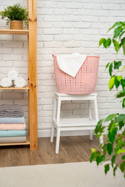 istock Pink plastic laundry basket in a bathroom 1727311671