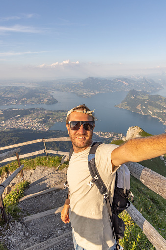 Tourist male taking selfie in the mountain