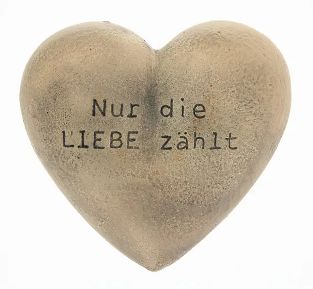 Only love counts - stone heart inscription in German
