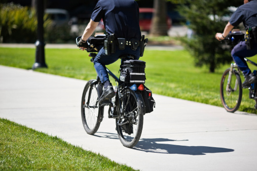 Police officers patrolling on bicycles.