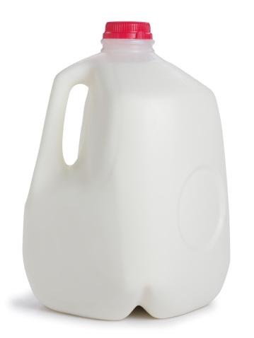A one gallon container of milk.