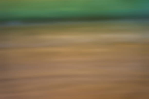 Abstract gradient blue, green and brown light background texture with horizontal motion blur