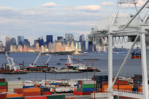 The view of Halifax city port with three cranes and a moored cargo ship (Nova Scotia, Canada).