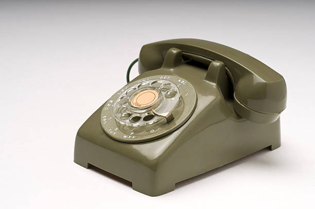 маленький зеленая телефон - obsolete landline phone old 1970s style стоковые фото и изображения