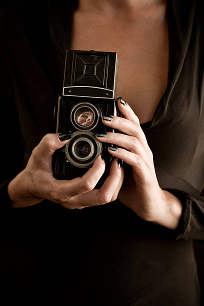 istock vintage camera photographer 172733904
