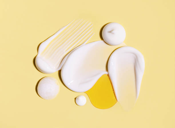 istock composition of cosmetic smears cream texture on pastel background 1727339333