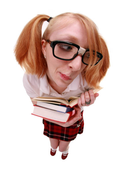 Reading Nerd A fisheye image of a cute nerd reading a book. embarrassment skirt photos stock pictures, royalty-free photos & images
