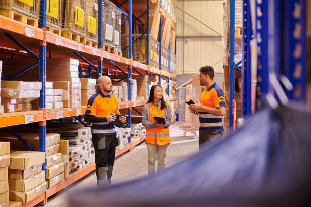 istock female warehouse supervisor with colleagues 1727356481