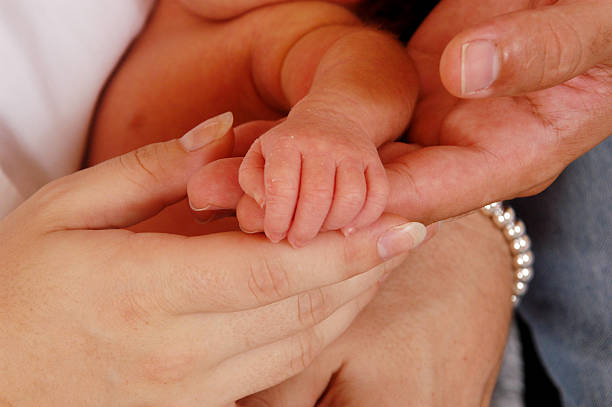 istock Parents holding newborns hand 172735788
