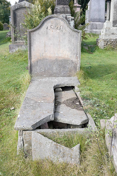 Vandalised Grave "A grave from 1820, damaged by vandals." desecrate stock pictures, royalty-free photos & images
