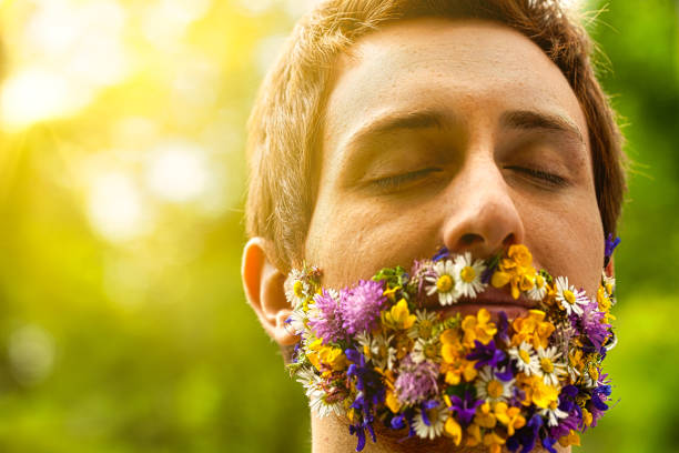 istock Nature lover's face adorned with vibrant blossoms 1727365687