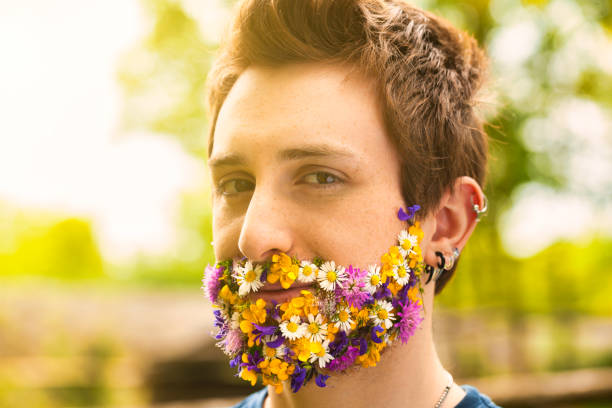 istock Vibrant petals on face, he stands unique 1727367887