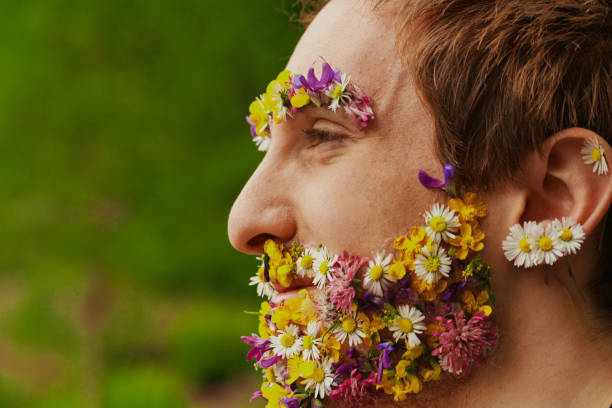 istock Among trees, man's flowered visage stands out 1727368452