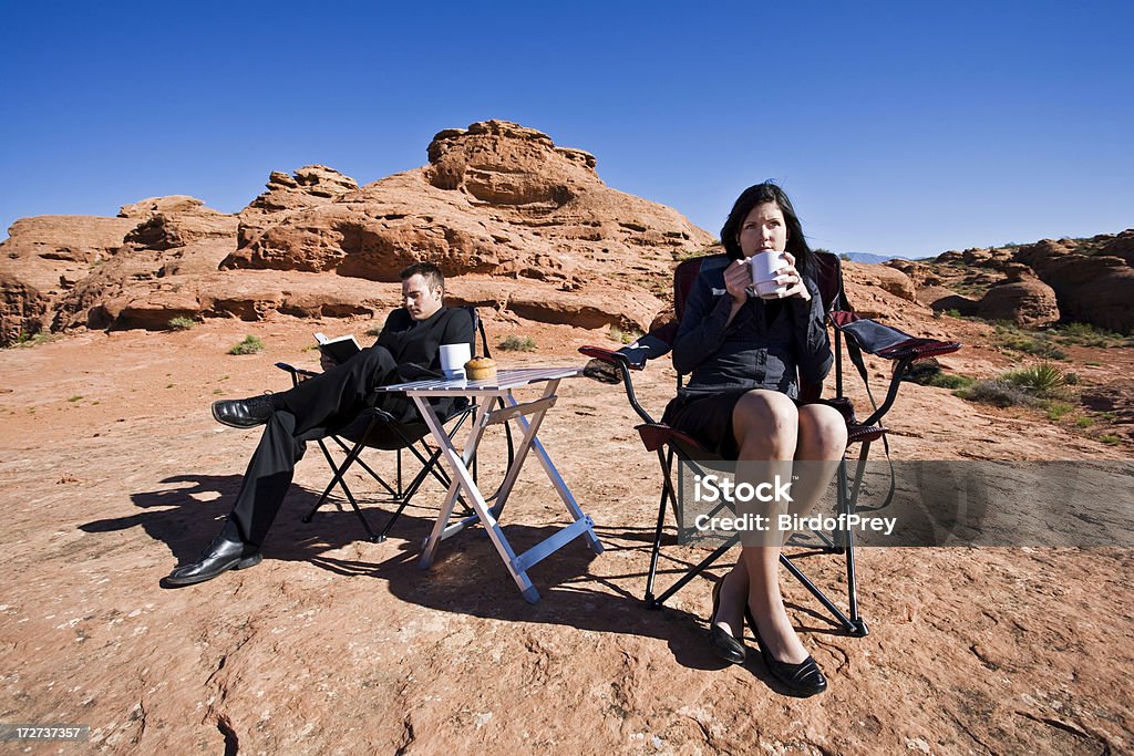 Desert Morning View. A young couple is relaxing and enjoying the morning view. Part of the Utah RedRockaLypse 2. Women Stock Photo