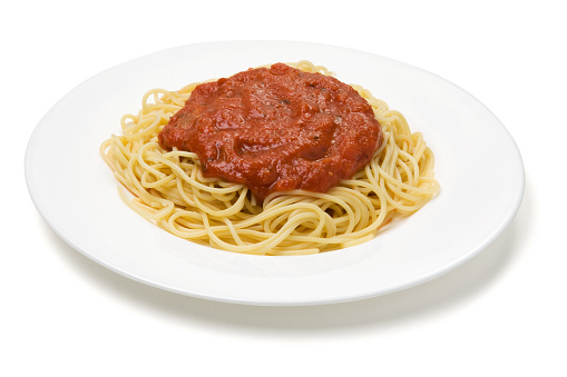 A plate of spaghetti and sauce isolated on white with clipping path.